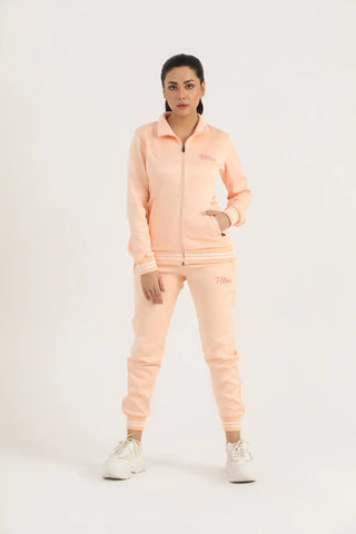 Model wearing Hilton Aesthetics women's peach classic zipper joggers with matching hoodie