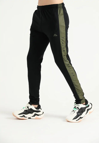 Black Elite performance joggers with contrast side graphics, walking side view