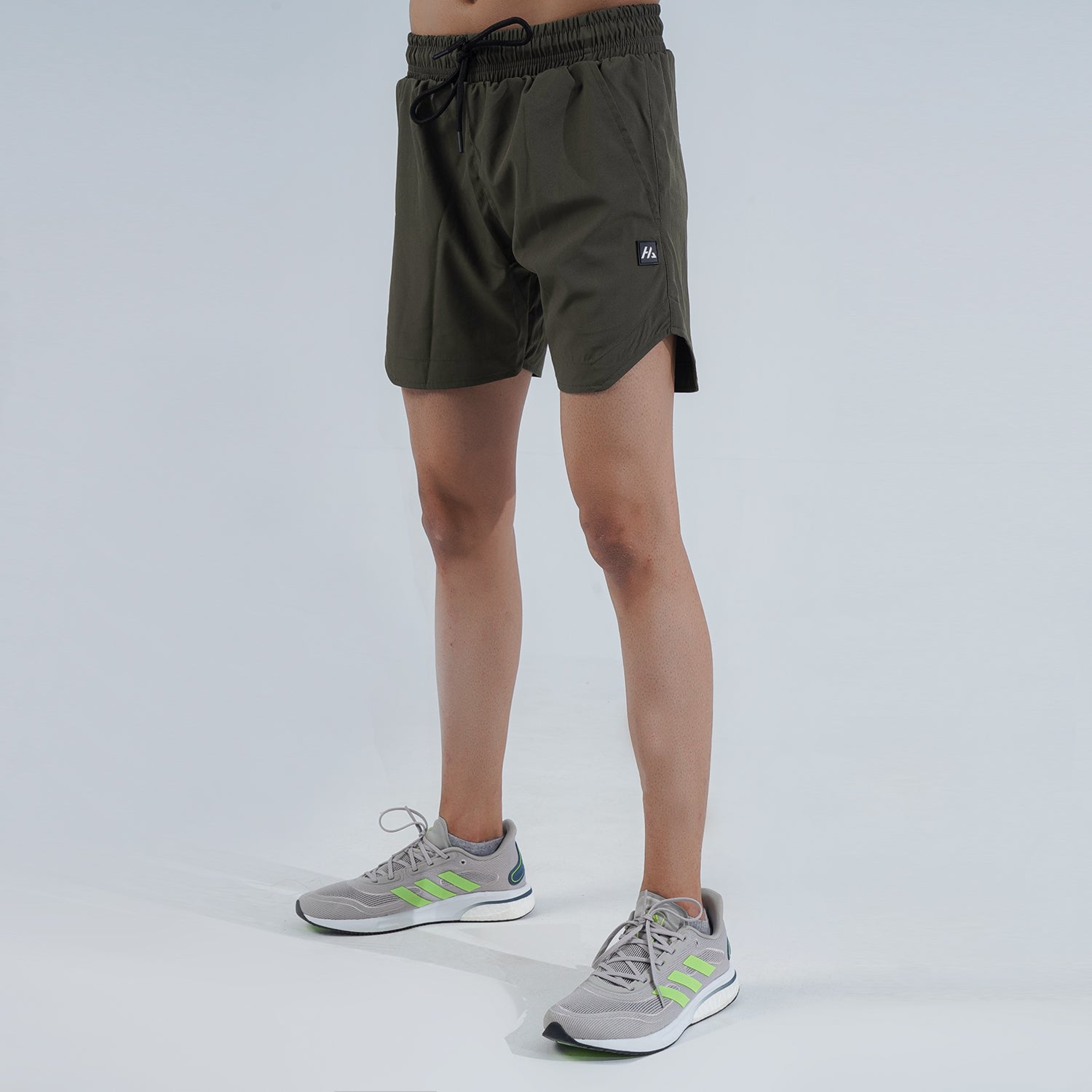 Performance Shorts by Hilton Aesthetics in dim grey, front view with slim-fit design and breathable quick-dry fabric.