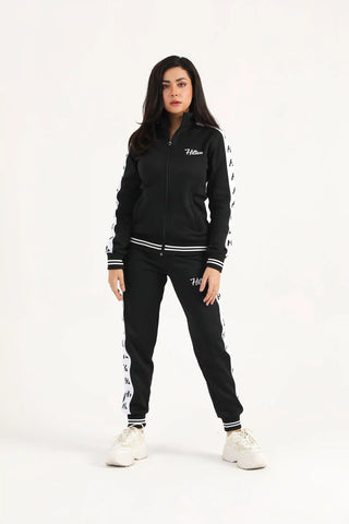 Model wearing Hilton Aesthetics women's classic zipper joggers with matching hoodie