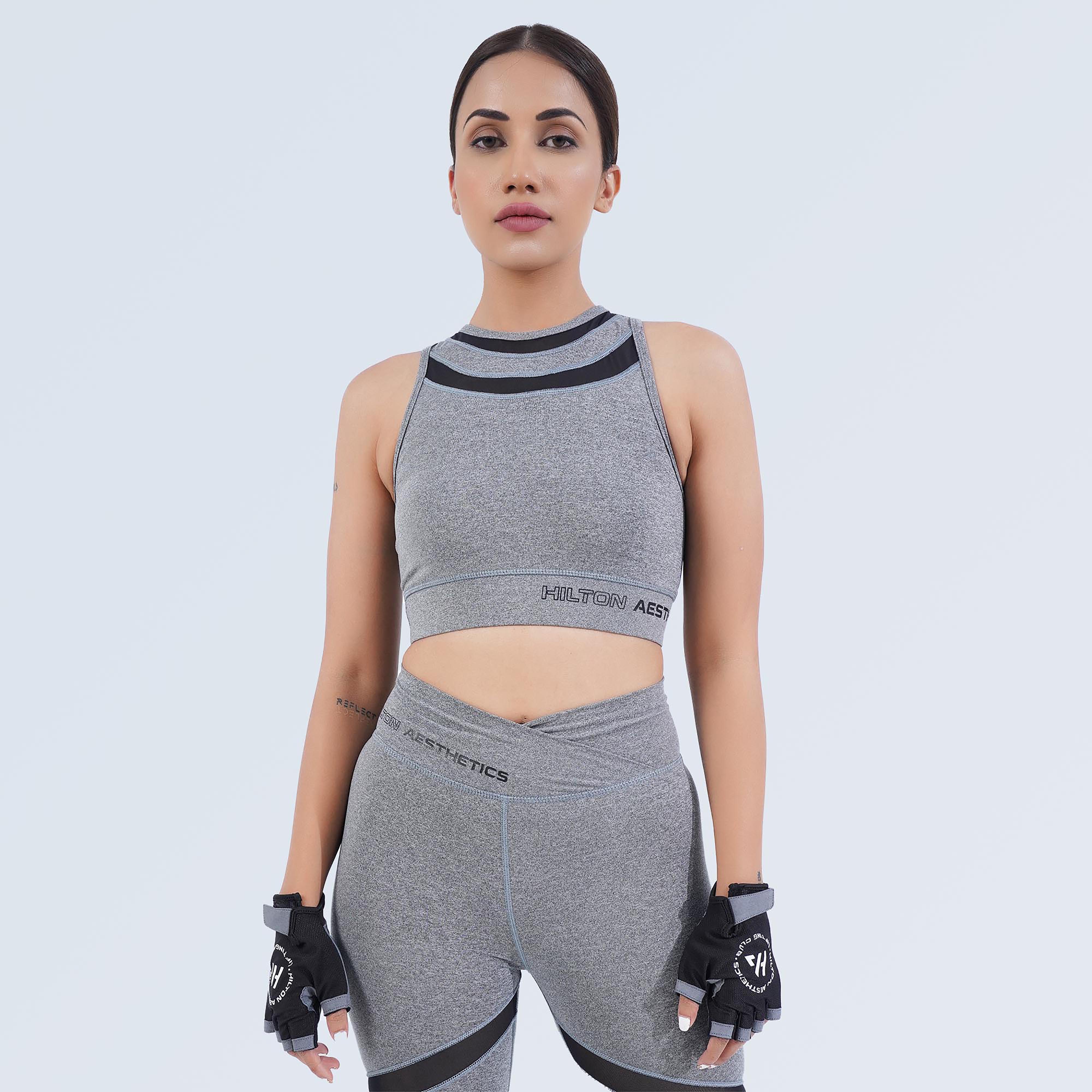 Women’s grey crop sports bra by Hilton Aesthetics with matching high-waisted leggings, front view