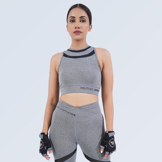 Women’s grey crop sports bra by Hilton Aesthetics with matching high-waisted leggings, front view