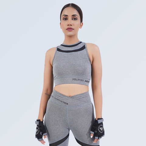 Women’s grey crop sports bra by Hilton Aesthetics with matching high-waisted leggings, front view
