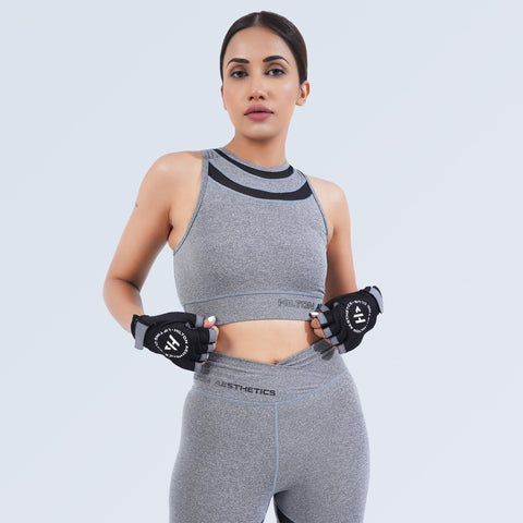 Women’s grey crop sports bra by Hilton Aesthetics with matching leggings, three-quarter view