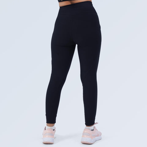 Back view of Hilton Aesthetics black high-waist pocket leggings on model