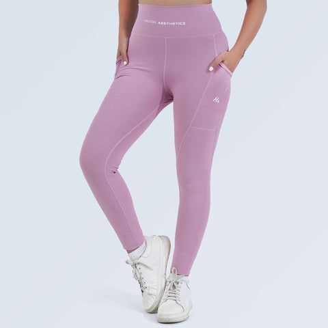Woman wearing dusty plum high-waist pocket leggings by Hilton Aesthetics, front view
