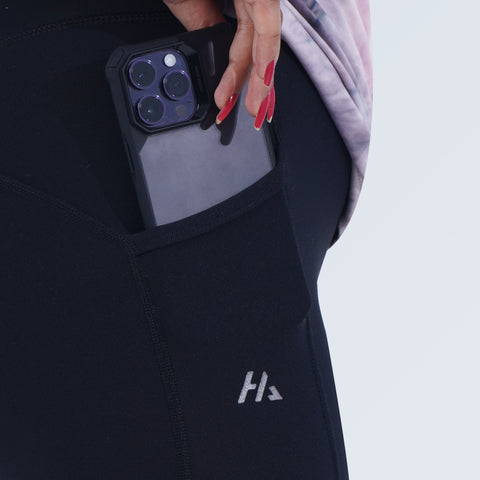 Close-up of side pocket detail on Hilton Aesthetics black high-waist leggings