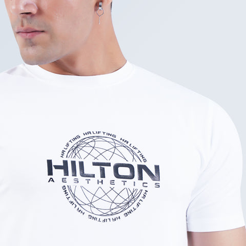 Close-up of Hilton Aesthetics HA LIFTING silk printed logo on white Power T-Shirt with crew neck design