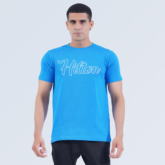 Front view of Crest Tee in Sky Blue, lightweight 100% cotton crew neck T-shirt by Hilton Aesthetics