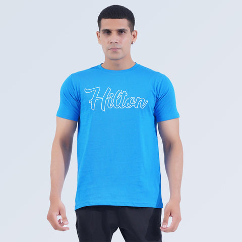 Front view of Crest Tee in Sky Blue, lightweight 100% cotton crew neck T-shirt by Hilton Aesthetics
