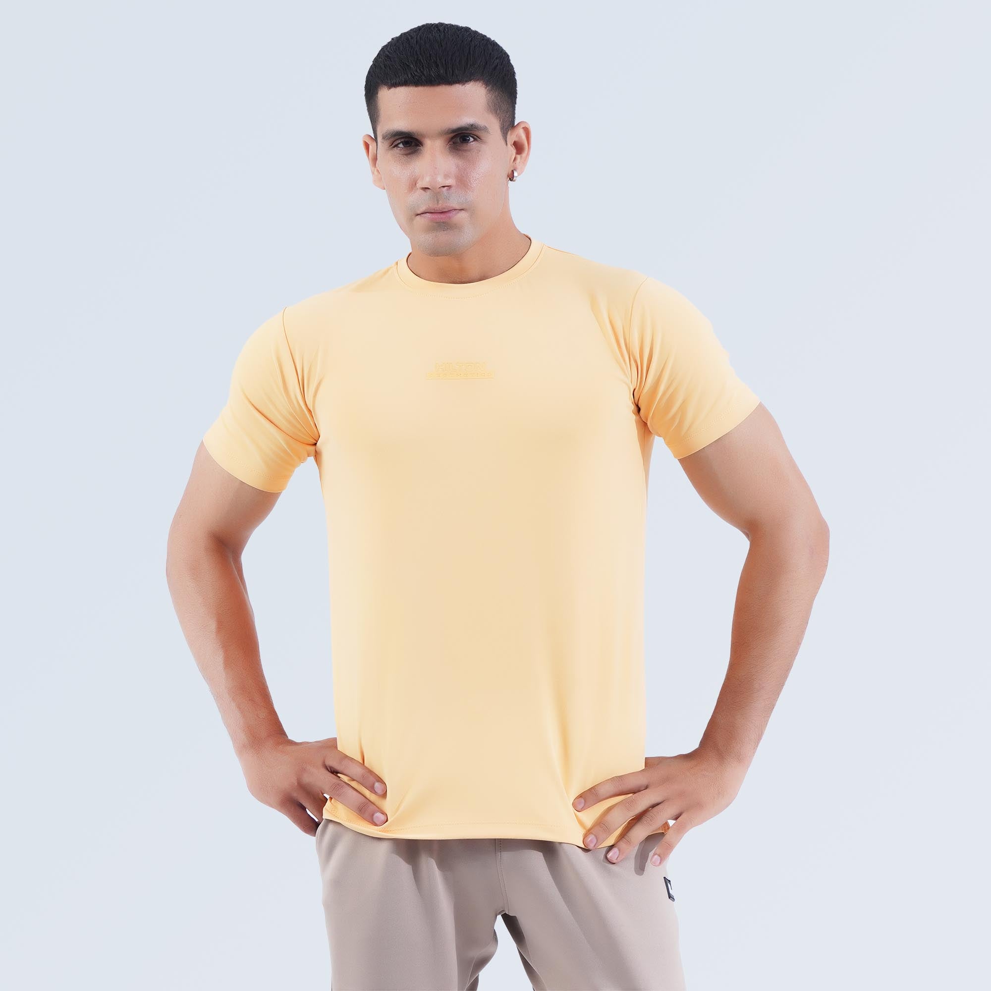 Hilton Aesthetics men's Dri-Fit performance T-shirt with moisture-wicking breathable stretch fabric and 3D printed logo.