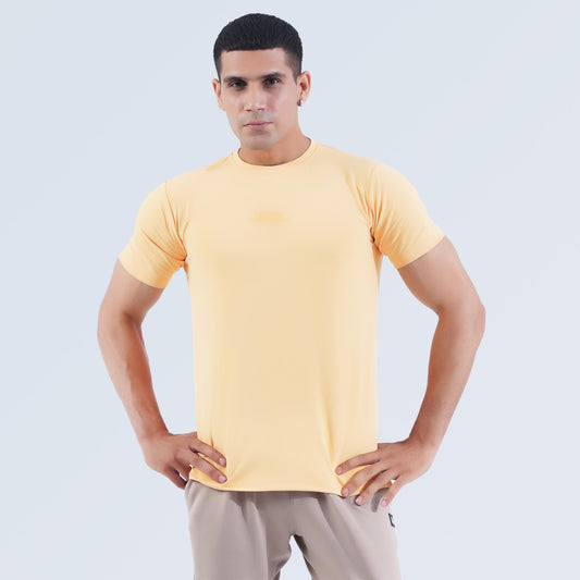 Man wearing wheat Hilton Aesthetics Dri-Fit gym T-shirt, front view