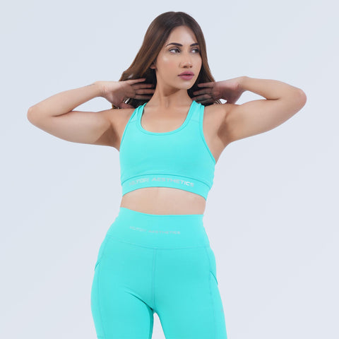 Woman wearing Hilton Aesthetics Impact Sports Bra in Aqua, front close-up
