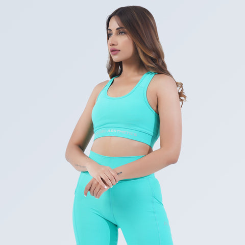 Hilton Aesthetics Impact Sports Bra and leggings in Aqua, side-angle view
