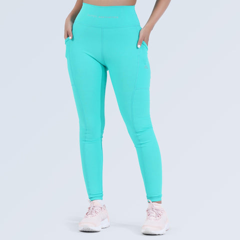 Woman wearing aqua high-waist pocket leggings by Hilton Aesthetics, front view