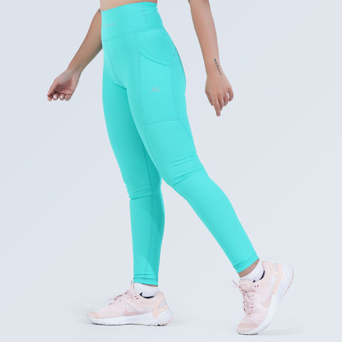 Woman modelling aqua high-waist pocket leggings with side pocket, side view