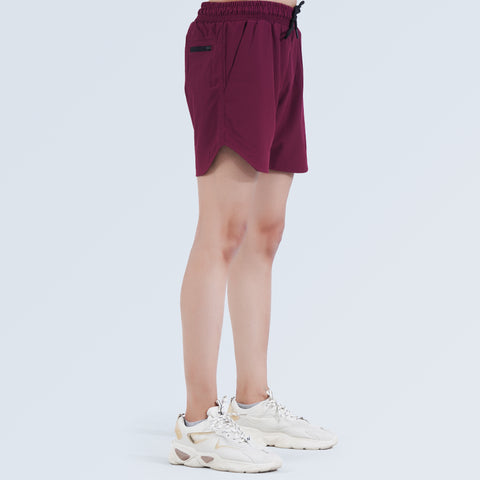 Side view of Hilton Aesthetics Ultimate Performance Shorts in burgundy