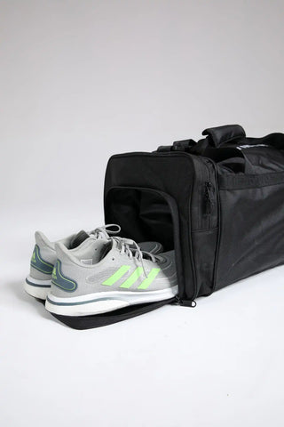 Open Hilton Aesthetics Everyday Holdall Gym Bag in Black showing spacious main compartment and organised storage.
