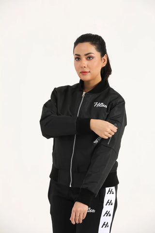 Model wearing Hilton Aesthetics Women's Bomber Jacket in black with premium fabric and ribbed cuffs