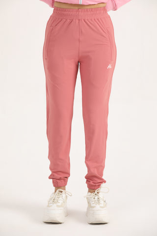 Women’s light coral Trace Joggers with tapered legs and drawcord waist, front view