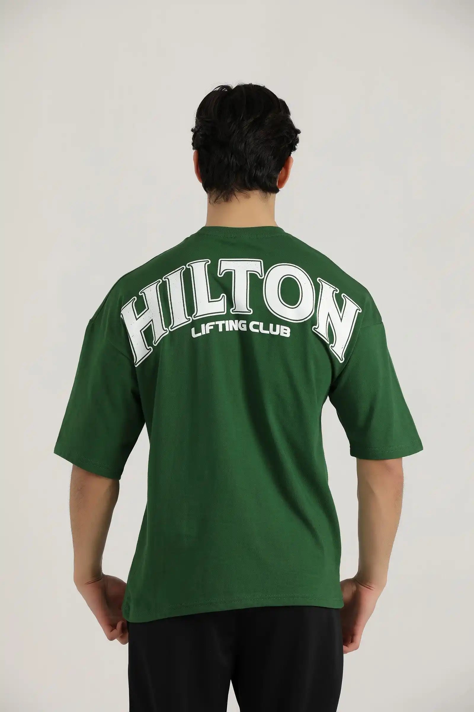 Hilton Aesthetics Lifting Oversized T-Shirt front view in green with relaxed fit and premium cotton fabric