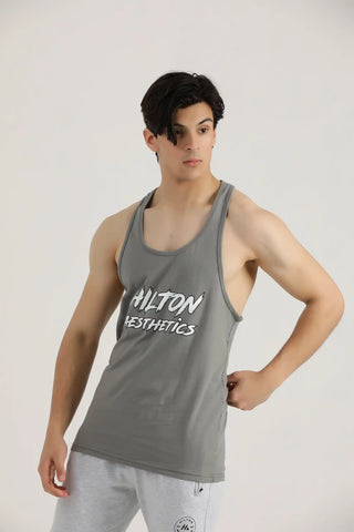 Man wearing a grey Hilton Aesthetics Power Stringer Tank Top, front view