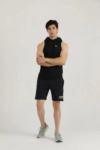 Full body view of a model wearing black Studio Shorts and a matching athletic tank by Hilton Aesthetics.