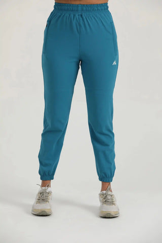 Trace Joggers by Hilton Aesthetics in teal, front view with slim-fit design and breathable stretch fabric.