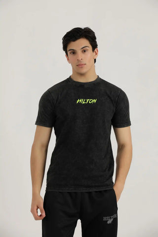 Hilton Aesthetics Vintage Washed T-Shirt front view in black with premium washed fabric and embroidered chest logo