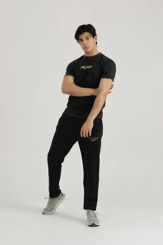 Model wearing Hilton Aesthetics Vintage Washed T-Shirt in black with regular fit and vintage washed finish