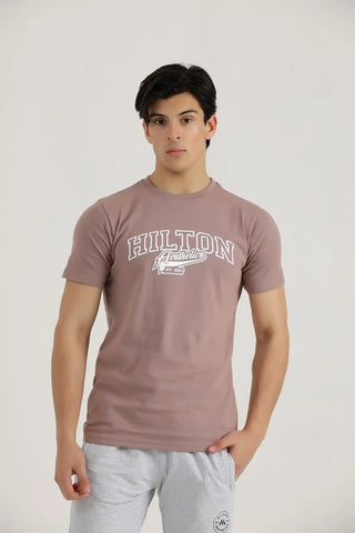 Man wearing a rosy brown Hilton Aesthetics Vital cotton T-shirt, front view