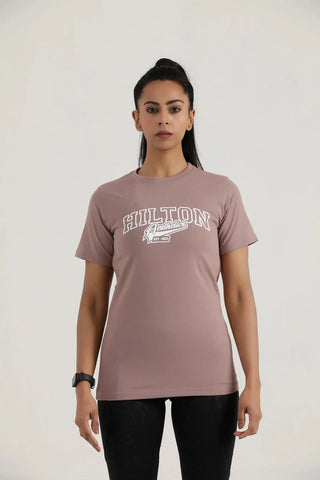 Model wearing Hilton Aesthetics Women's Vital Tee in Rosy Brown with soft cotton fabric for gym and everyday wear.