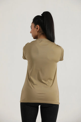 Woman wearing a beige t-shirt against a white background