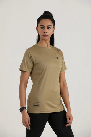 Woman wearing a beige t-shirt with a logo on a white background