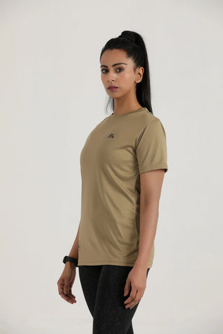 Woman wearing a beige t-shirt with a logo on a white background
