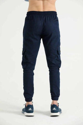Men’s navy cargo joggers with tapered legs and elastic cuffs, back view