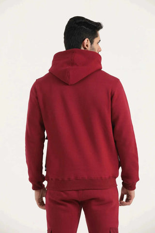 Men’s burgundy Crest Cargo Hoodie showing the hood and athletic fit, back view