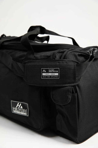 Essential Gym & Travel Duffel Bag with zipper pockets, shoulder strap and Hilton Aesthetics logo