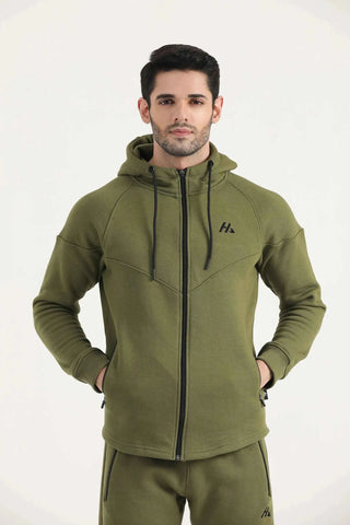 Man modelling dark olive Hilton Aesthetics Flexx Zip-Up Hoodie, hands-on-hips view