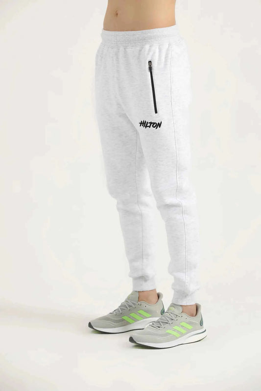 Hilton Aesthetics Oatmeal Embroider Joggers side view in oatmeal with tapered fit and embroidered log