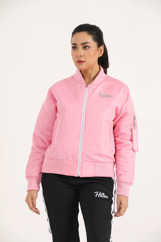 Woman wearing light pink Hilton Aesthetics Quilted Bomber Jacket, front view