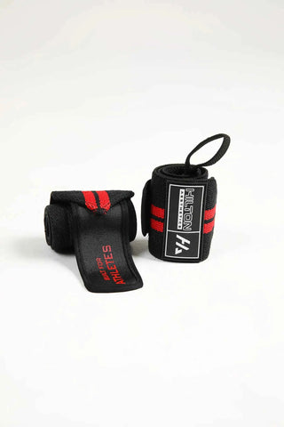 Black and red Hilton Aesthetics lifting wrist wrap with thumb loop, flat-lay view